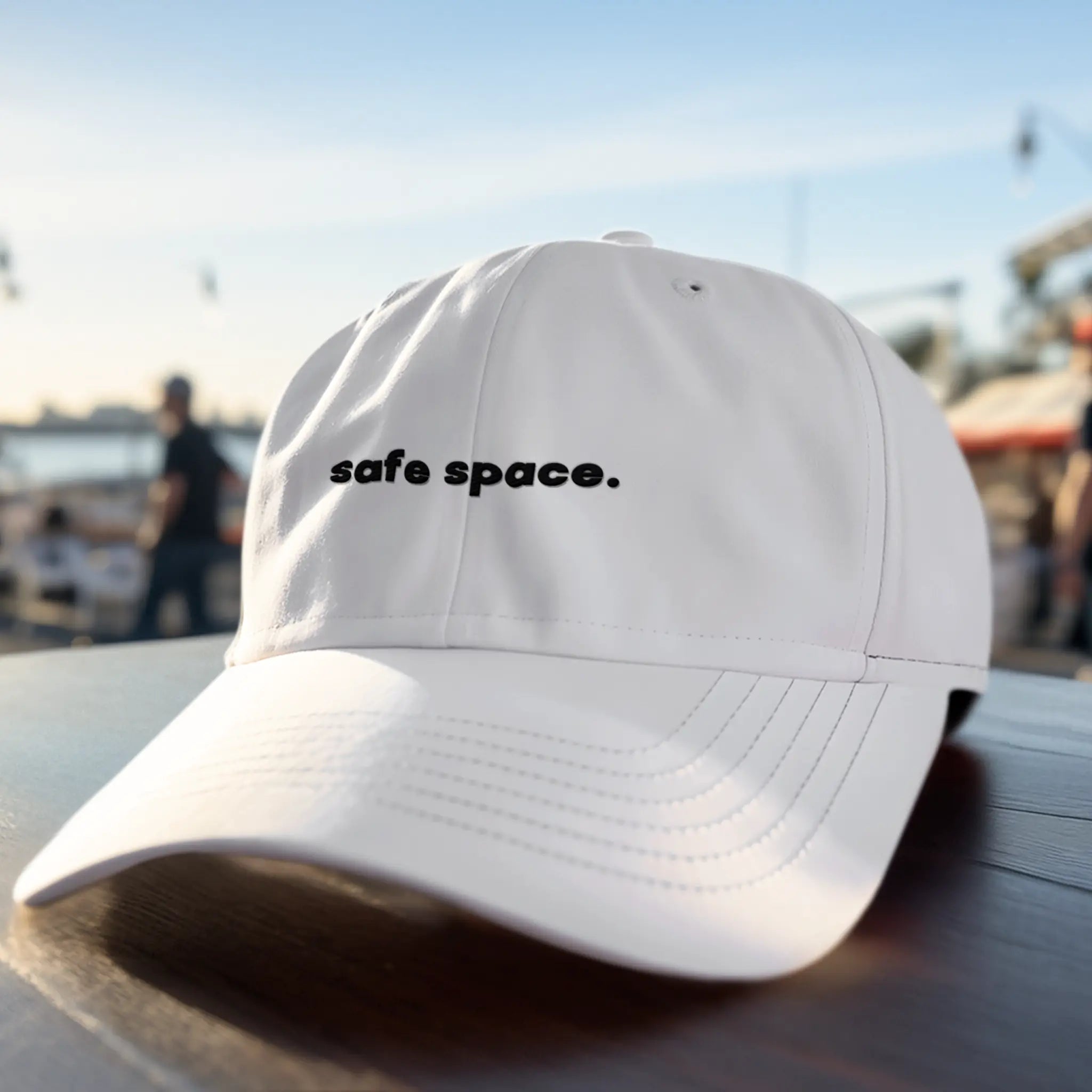 White embroidered dad hat with “safe space.” text, LGBTQ pride ally hat