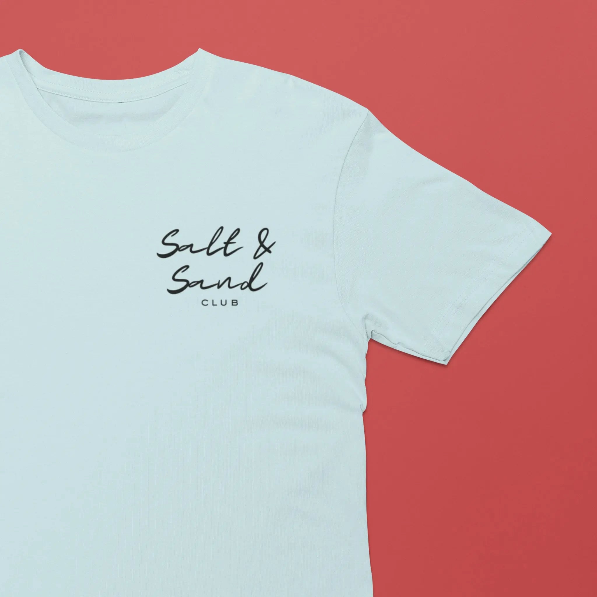 Minimal front logo “Salt & Sand Club” on white shirt, coastal aesthetic summer t-shirt