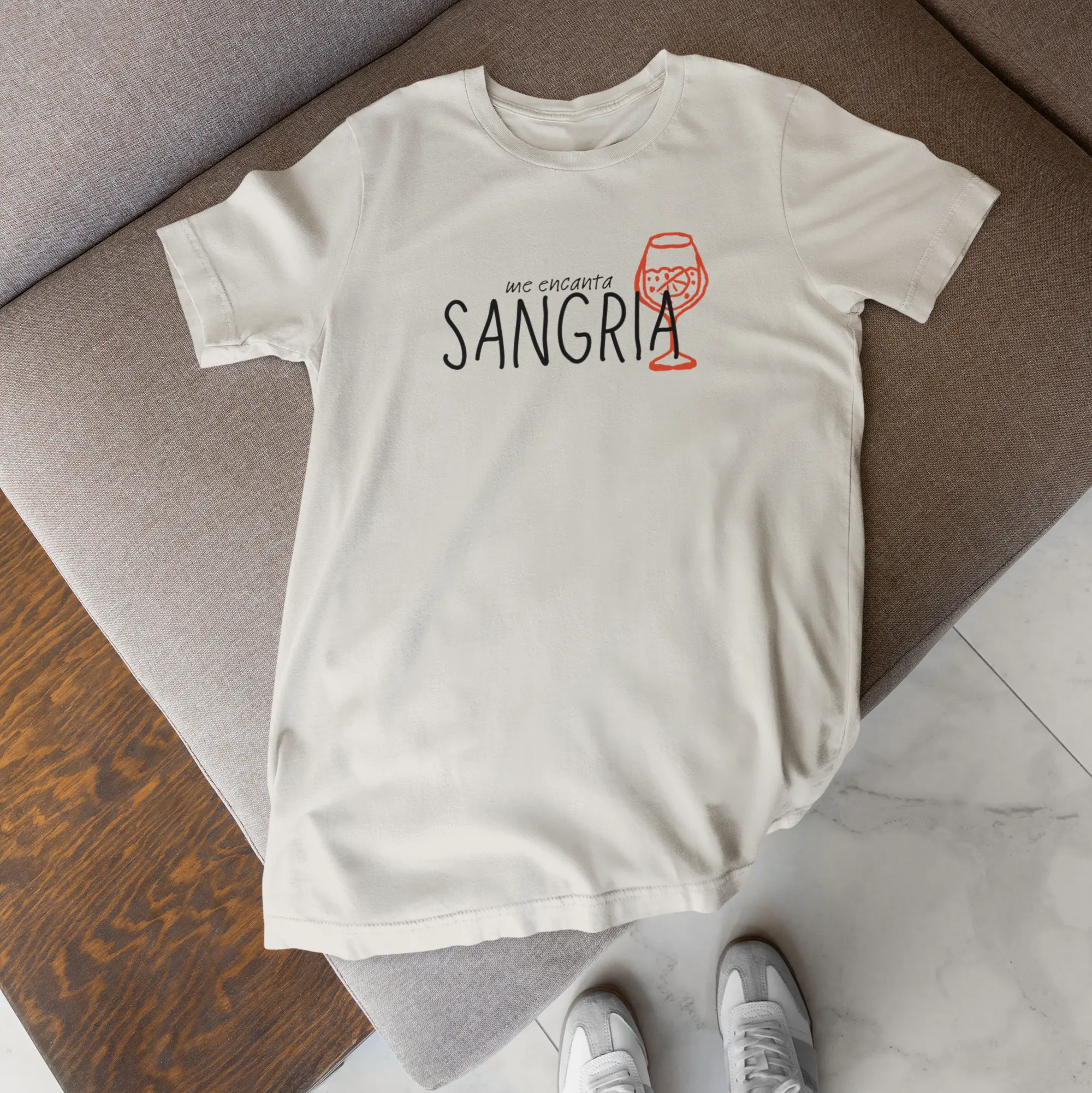 White graphic t-shirt reading “me encanta SANGRIA” with orange wine glass illustration, sangria lover shirt
