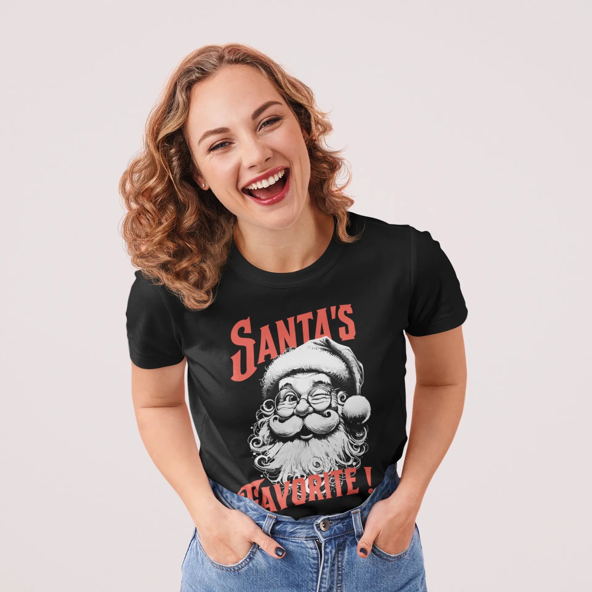 Christmas t-shirt gift idea with Santa face artwork and “Santa’s Favorite!” text, unisex holiday tee
