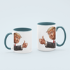 Light Blue Donald Trump thumbs-up graphic ceramic mug available in 11 oz and 15 oz sizes, featuring a durable design with blue handle and interior.