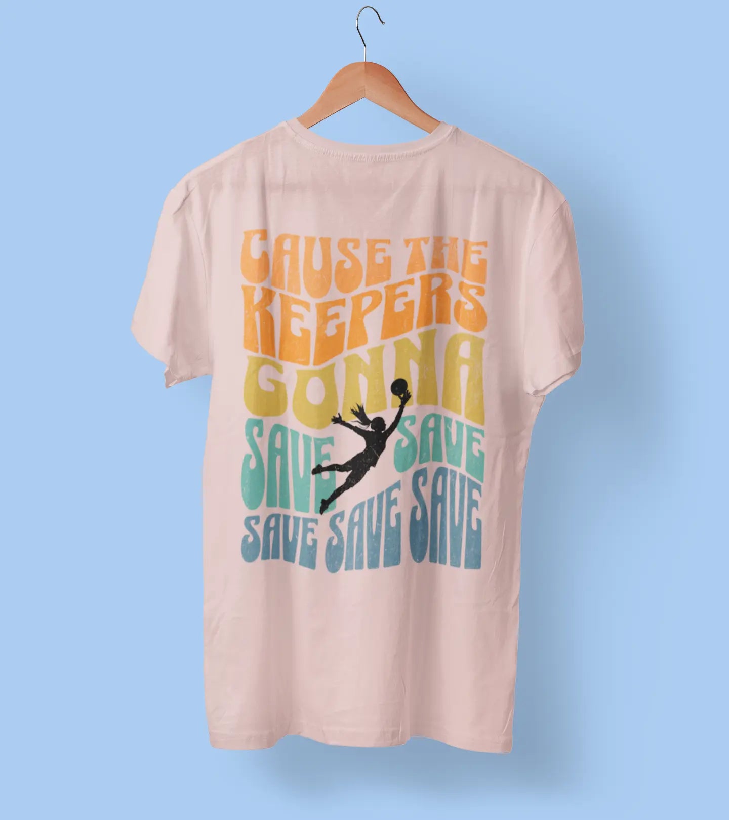 Back view of pink girls soccer goalkeeper t-shirt on hanger "Keepers Gonna Save Save Save" - goalie shirt celebrating goalkeeper pride and saves
