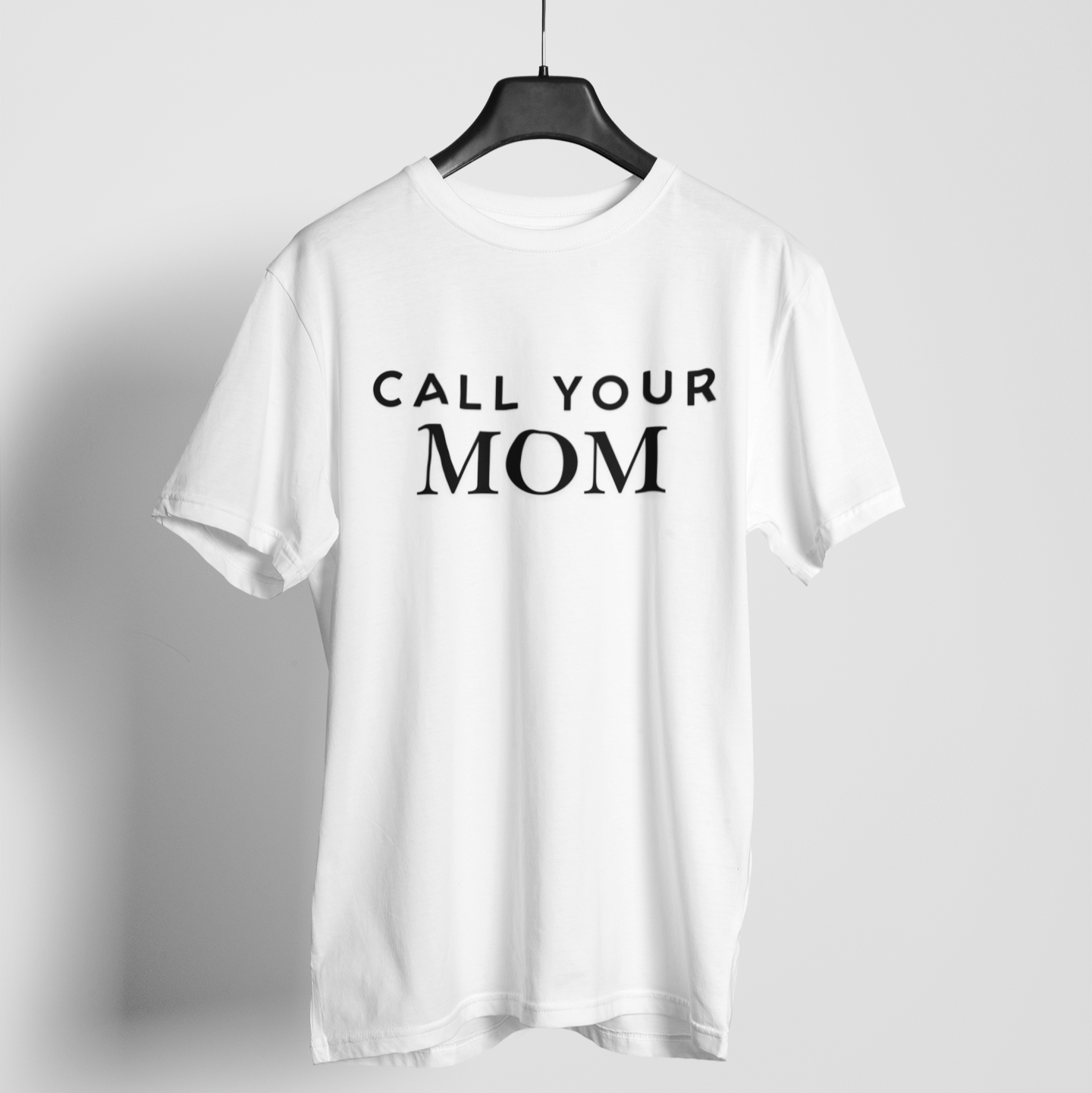 Call Your Mom' white blue t-shirt with bold lettering, a snarky and funny reminder to check in.