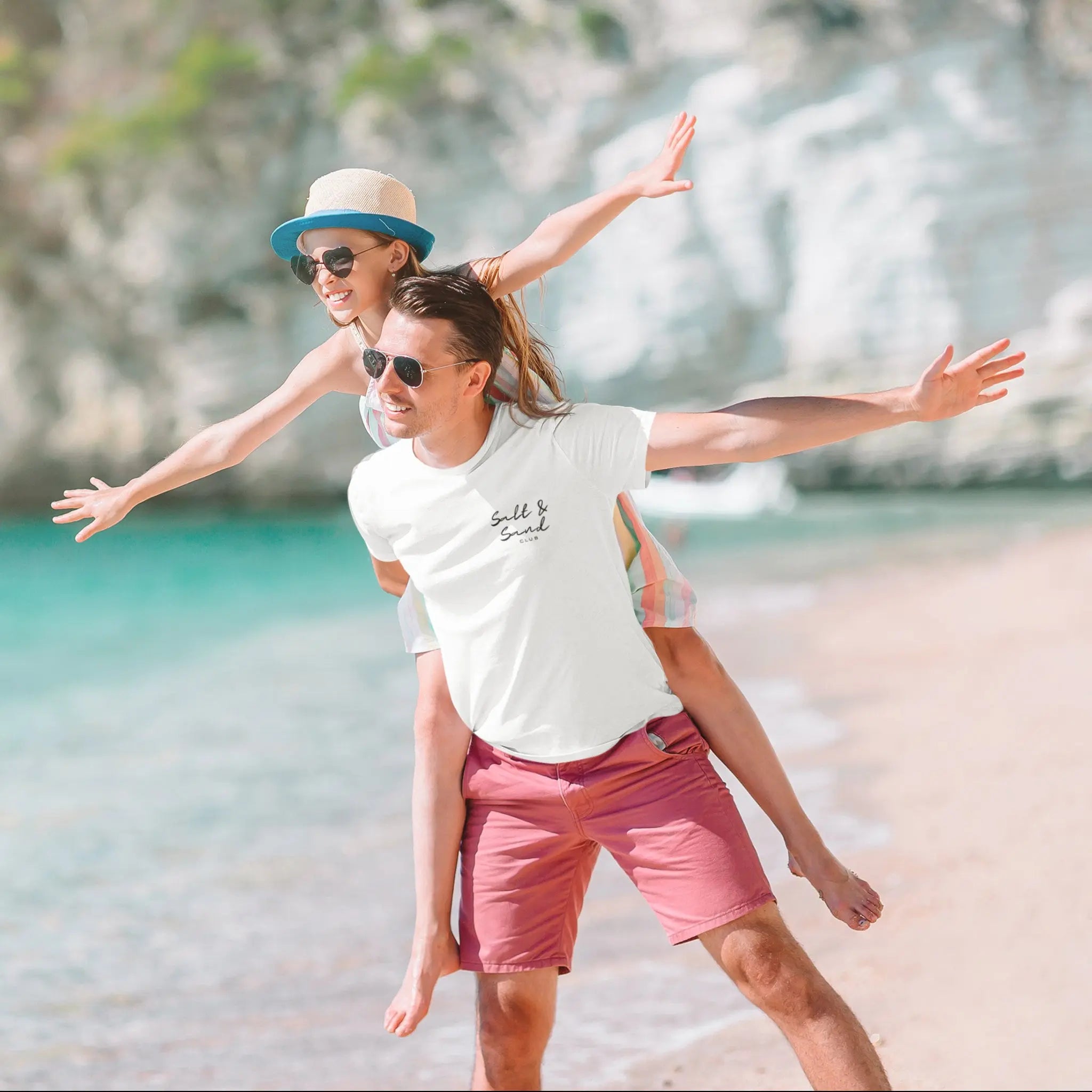 White coastal t-shirt with “Salt & Sand Club” branding, beach trip and resort wear style graphic tee
