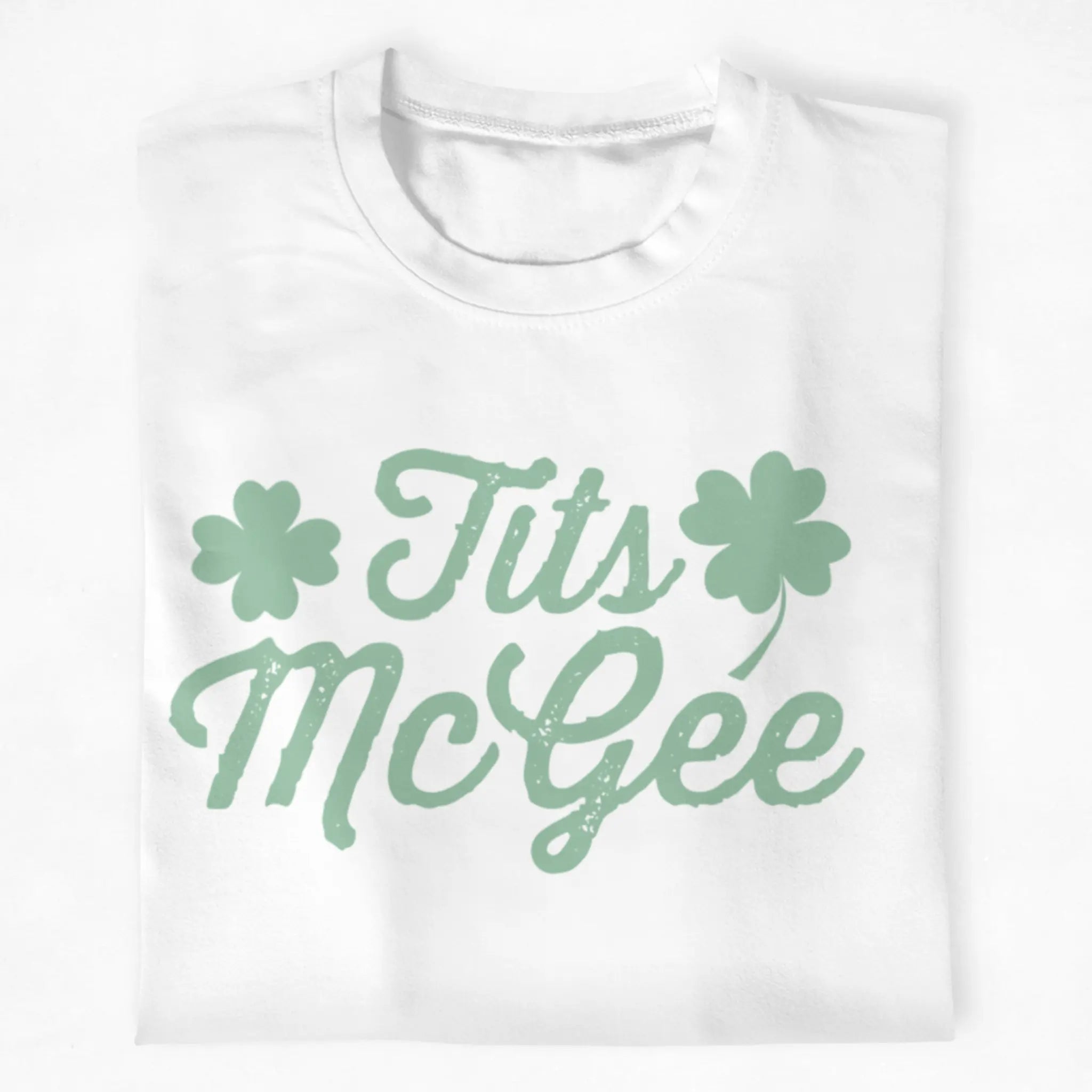 White St. Patrick’s Day t-shirt with green “Tits McGee” text and shamrock graphics, funny Irish party shirt