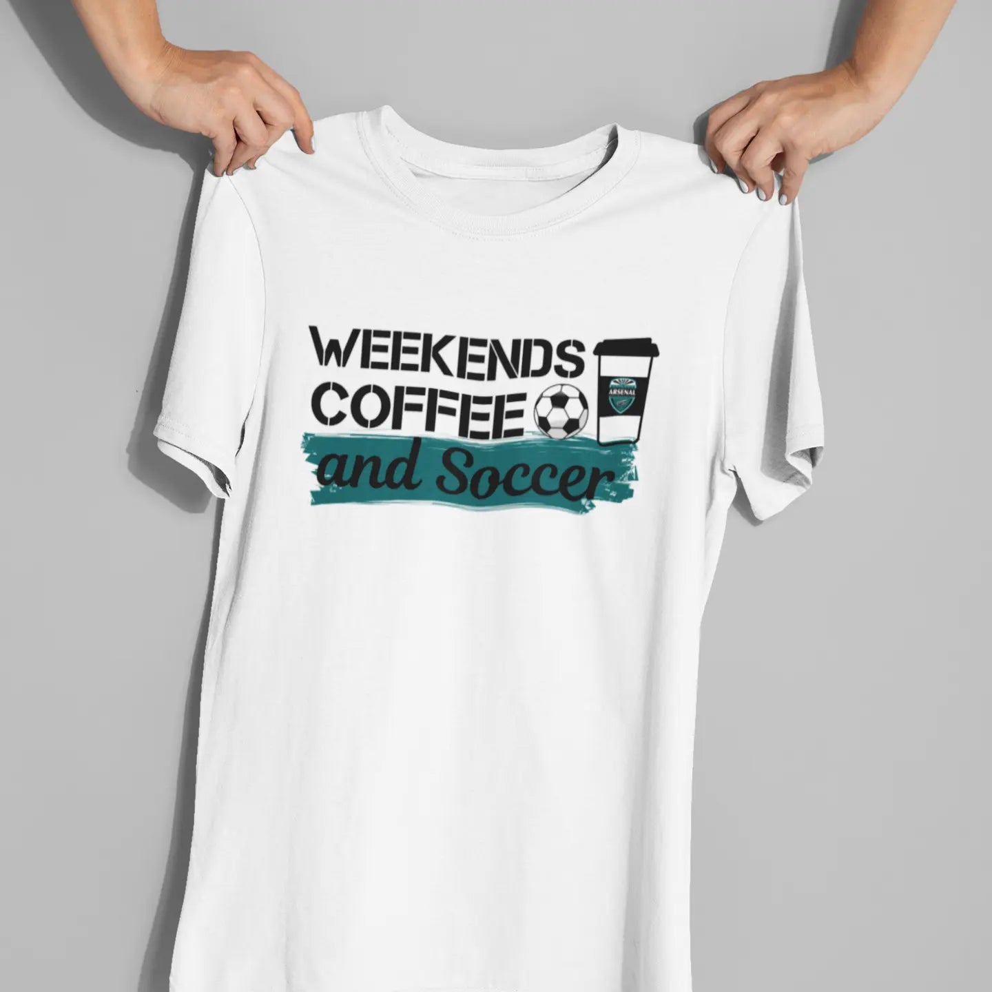 Lifestyle flat lay of "Weekends Coffee Soccer" tee - sports mom shirt celebrating weekend tournament life and coffee addiction