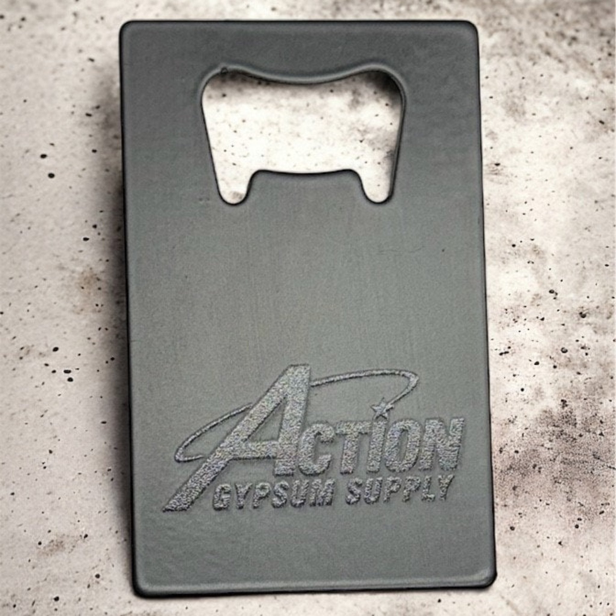 Black custom bottle opener business card featuring brands logo, perfect for branded promotional items in the construction and building supply industry.